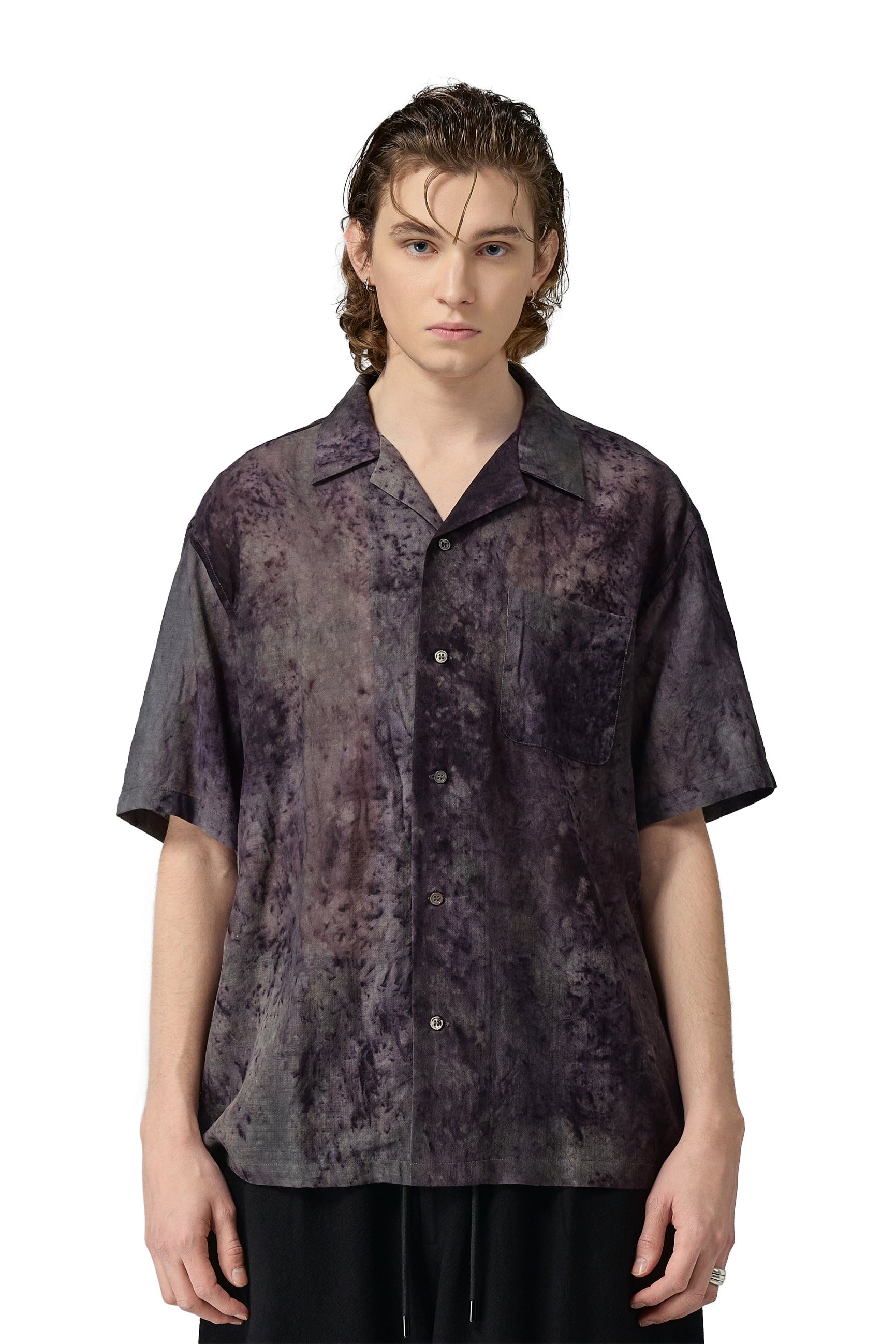 A short-sleeved, button-up bowling shirt with an open collar. The shirt is wool with special eco-dyeing and features a patch pocket on the left side. 